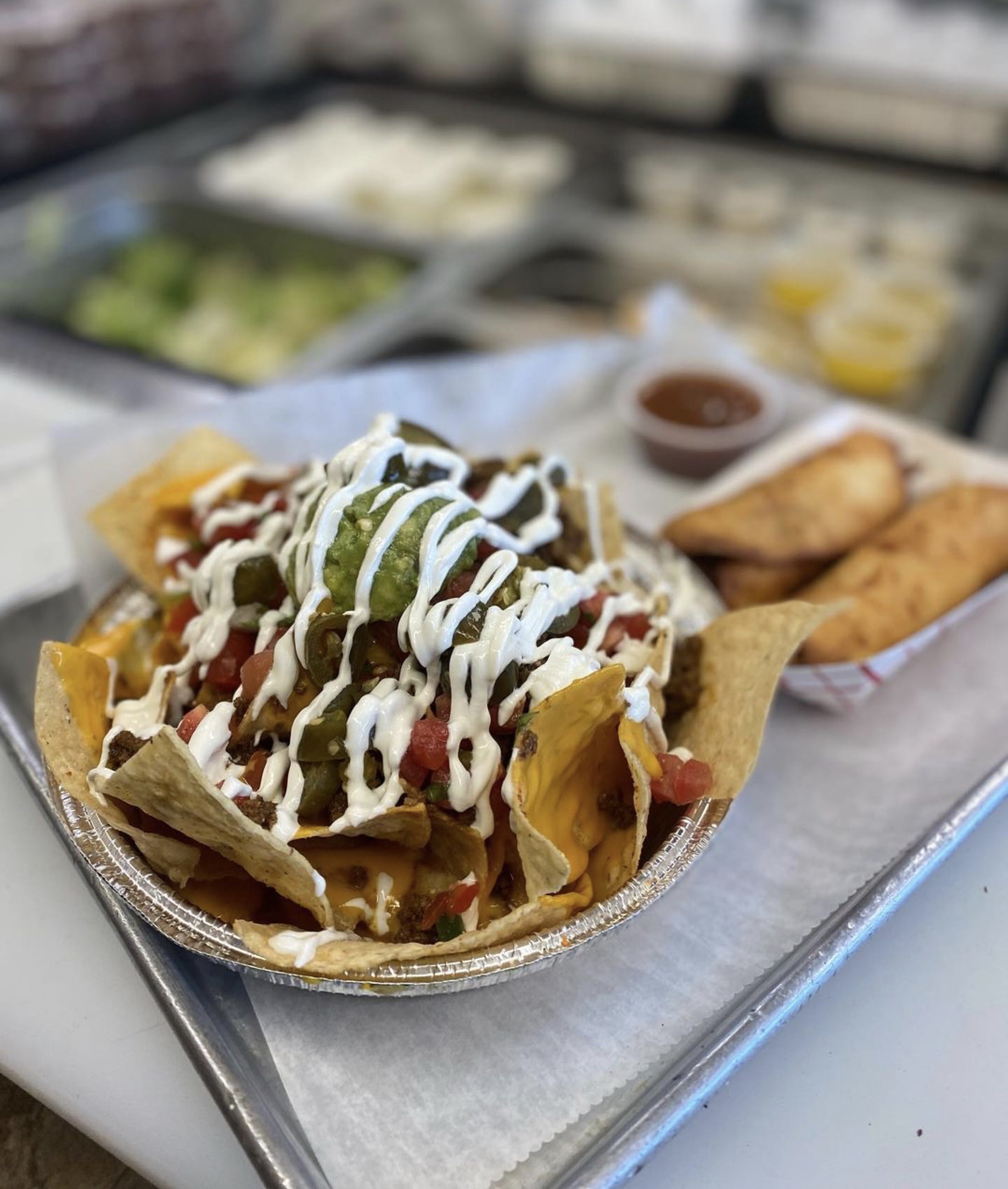 A delicious tray of loaded nachos